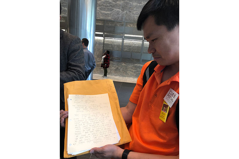 Preston’s father, Hsi-Pei, delivers letters from students, including this one, in braille, asking the Governor for support. He wants to prevent tragedies like the death of his three-year-old daughter. (All photos courtesy of James McCray, Hy-Sync Media.)