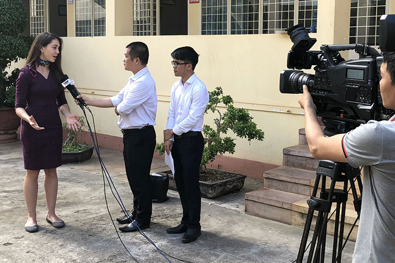 FIA Foundation UN Representative and North American Director Natalie Draisin does local media interviews, talking about how Gia Lai province will help others learn how to meet the WHO’s target of 100% helmet wearing by 2030.